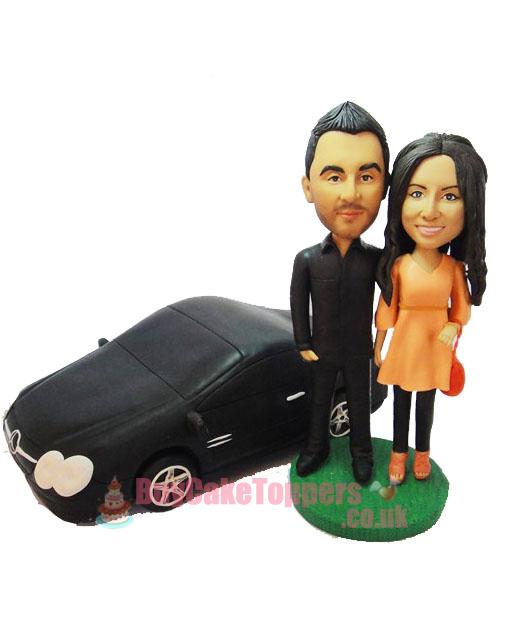 couple with car wedding cake topper 